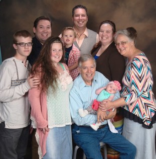 The Garfinkles: Hayden (my kiddo), Heather (SIL), Bill (dad) holding Haleigh (niece), Pam (mom); Kevin ("baby" brother), Asher (nephew), Steven (oldest younger brother), Me.